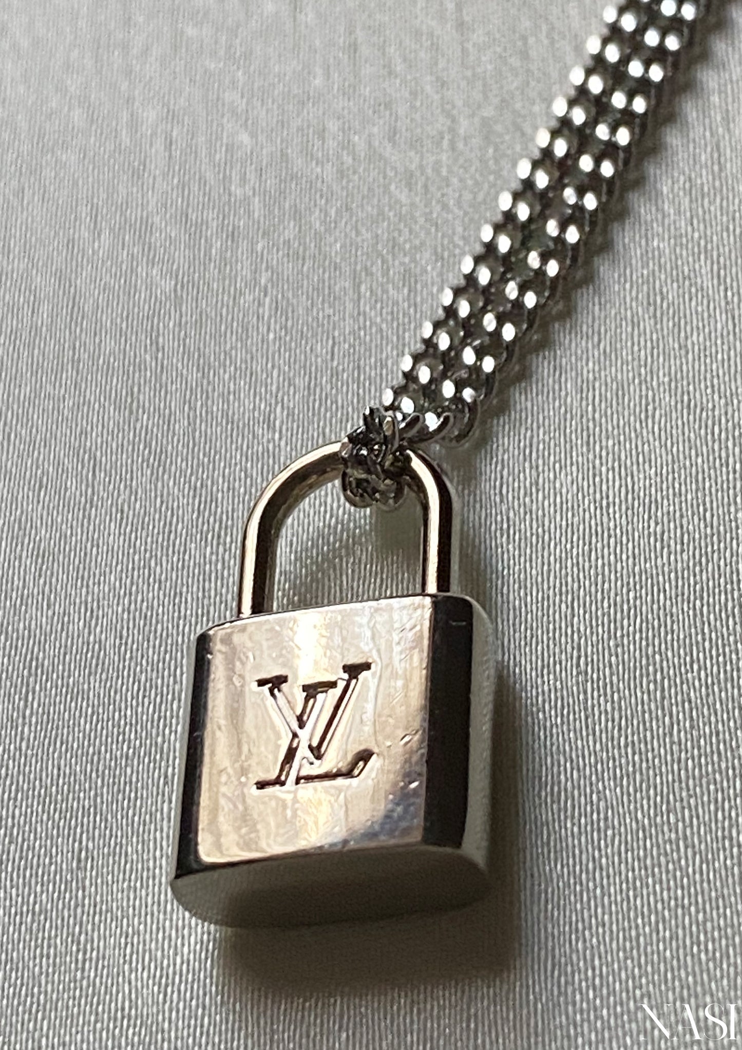 Silver Louis Vuitton Lock Necklace